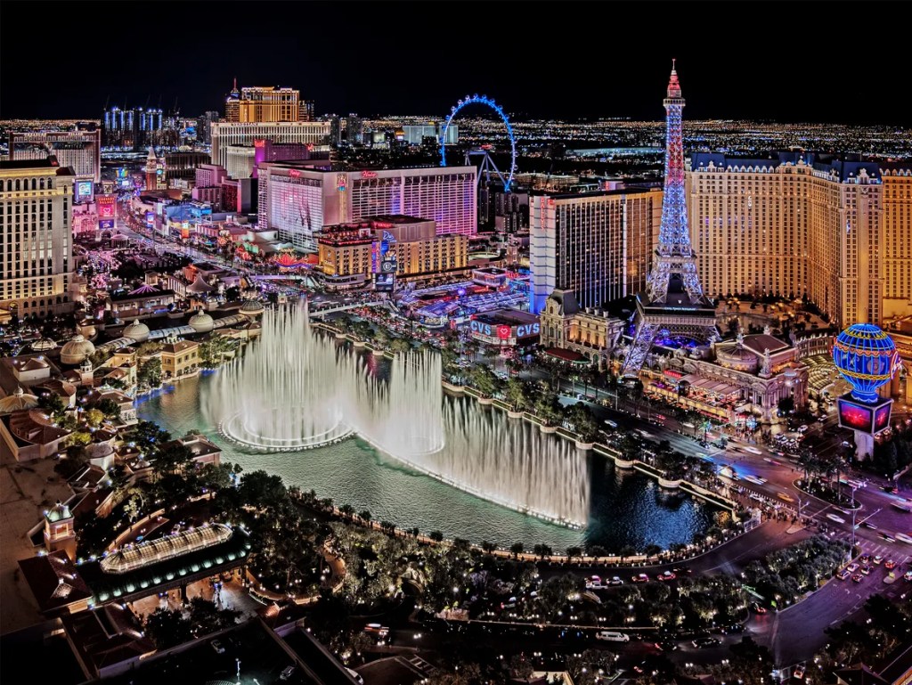 The famous Las Vegas Strip with the Bellagio Fountain The Strip is home to the largest hotels and casinos in the world.